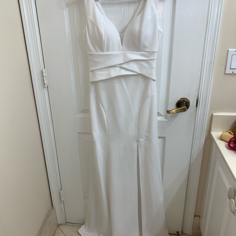 White floor length evening gown with slit